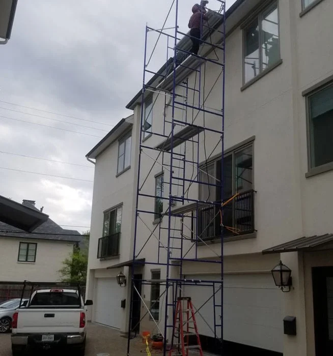 Narrow access scaffolding setup on residential property by Long Beach Scaffolding.