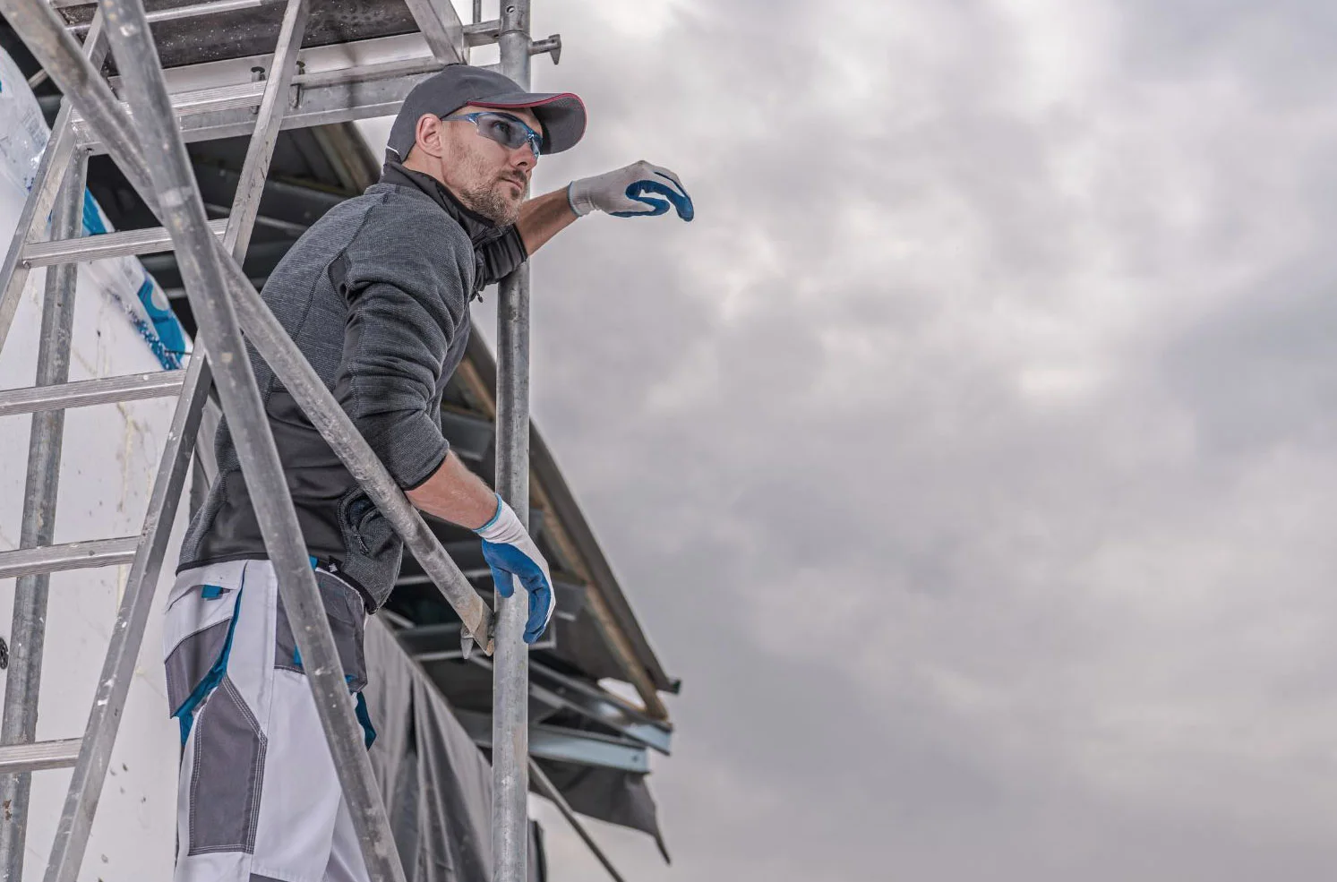 Building protected with safety netting and Long Beach Scaffolding during exterior renovation